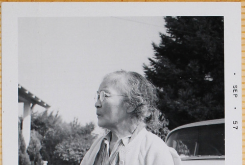 Woman standing by car (ddr-densho-522-423)