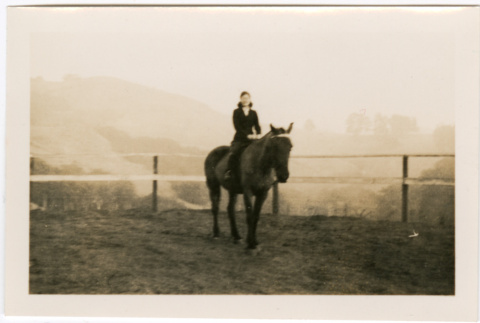 Tomoye (Nozawa) Takahashi riding a horse (ddr-densho-426-1711)