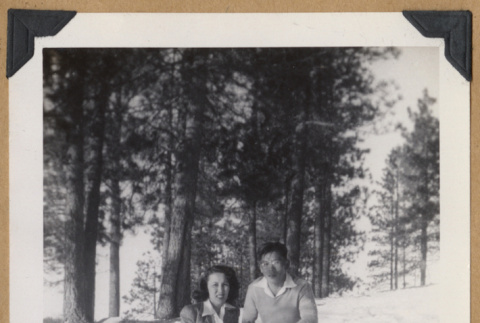 Two people kneeling in the snow (ddr-densho-542-328)