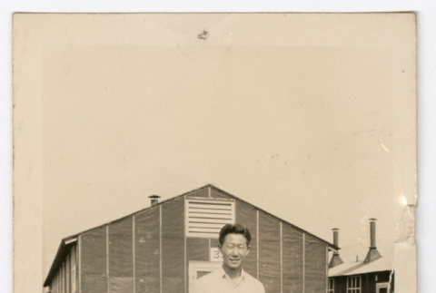 Man in front of barracks (ddr-densho-545-4)