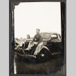 Yosh Kikawa sitting on the hood of a car (ddr-densho-542-364)