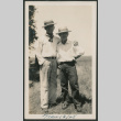 two men outside in straw hats (ddr-densho-378-644)
