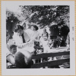 Yoshiko and Leslie Shiomi with other children with monkey in dress (ddr-densho-522-412)