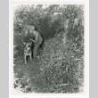 Private Russell P. Miszner and dog (ddr-densho-1007-101)