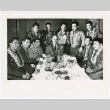 Servicepeople with leis gathered around table (ddr-densho-1007-264)