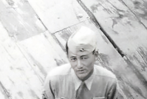 Jack Warren Saburo Yamashiro standing on dock (ddr-densho-474-234)