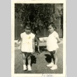 Two sisters in front of barracks (ddr-manz-6-58)