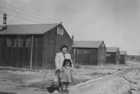 Mother and daughter near barracks (ddr-densho-128-149)
