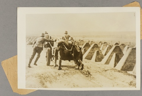 Soldiers pushing a cart (ddr-njpa-13-1641)
