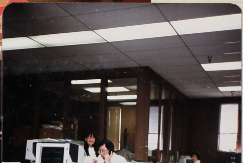Man on phone in office (ddr-densho-426-1282)