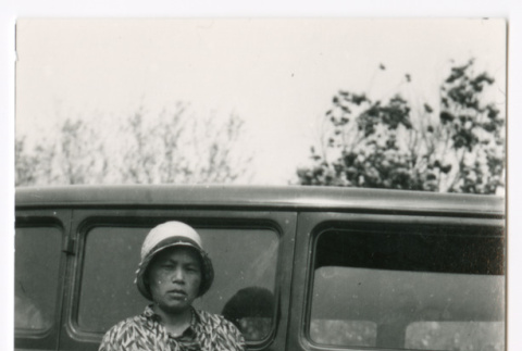 Woman and child next to car (ddr-densho-480-85)