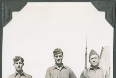 Three men in uniform with rifles (ddr-ajah-2-133)