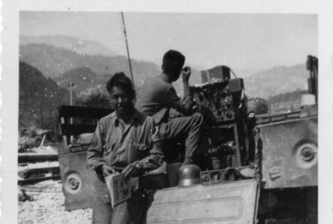 [Men in military uniform with military vehicle] (ddr-csujad-1-39)