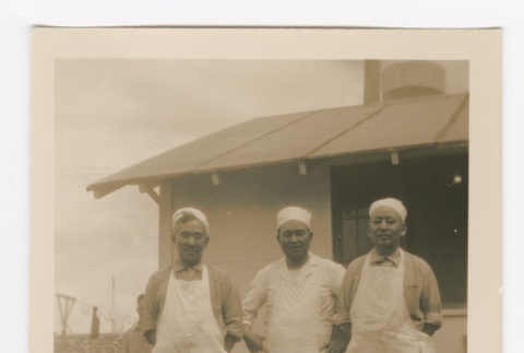Men in white caps and aprons posing (ddr-densho-223-34)