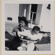 Susan Shiomi in stroller with William Shiomi in cowboy hat (ddr-densho-522-134)