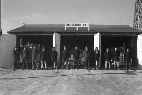 Firemen standing in front of Fire Station No. 1 (ddr-fom-1-754)