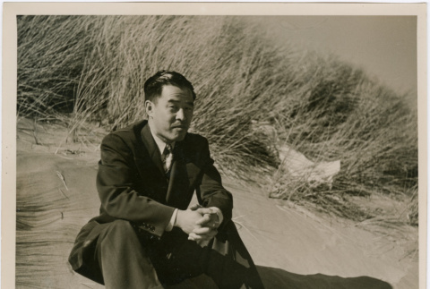 Man sitting on beach (ddr-densho-426-1026)