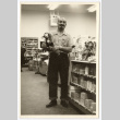 Man holding a toy (ddr-densho-542-797)