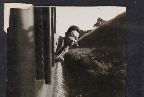 Man in train window (ddr-densho-468-401)