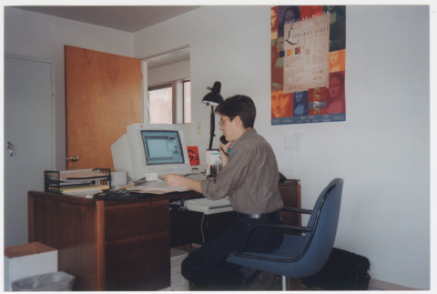 Geoff Froh at desk (ddr-densho-506-71)