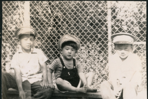 David, Chester Jr. and Gerald Sakura wearing military caps (ddr-densho-523-159)