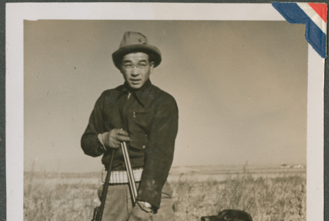 A hunter with his dog (ddr-densho-201-934)