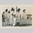 Nurses carrying a stretcher in an Armistice Day parade (ddr-densho-37-1174)