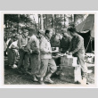 Members of the 100th Infantry Battalion having meal in bivouac (ddr-densho-1007-153)