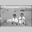 Two boys sitting on beach (ddr-densho-426-2002)