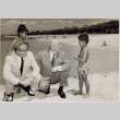Samuel Wilder King at Ala Moana Beach with a city employee and two young boys (ddr-njpa-2-210)