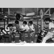 Group playing music in the boys cabin (ddr-densho-336-197)