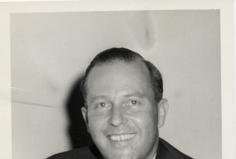 Man smiling for a photograph (ddr-njpa-2-448)