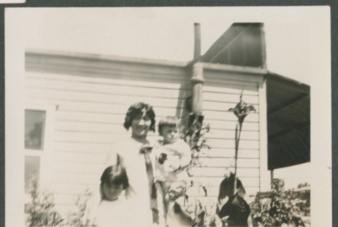 woman holding baby next a young child (ddr-densho-378-731)