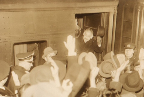 Yosuke Matsuoka waving to a crowd from a train (ddr-njpa-4-898)