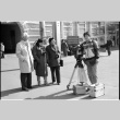 Harry Fukuhara, Loni Ding, one other, and cameraman (ddr-densho-1007-1178)