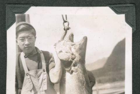 Benjamin holding large fish (ddr-densho-540-83)