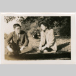 Tomoye (Nozawa) Takahashi and Tomoyuki Nozawa sitting in park (ddr-densho-426-2105)
