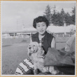 Woman holding dog (ddr-densho-522-327)