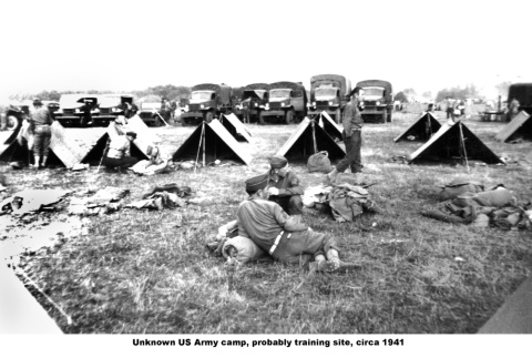 Men sitting near tents and line of trucks (ddr-ajah-2-774)