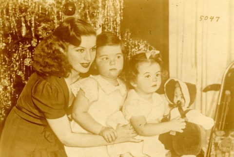 Jack Dempsey with Hannah Williams and their daughters, Barbara and Joan Hannah, at Christmas (ddr-njpa-1-165)