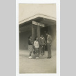 Nisei men and women standing outside the school offices building (ddr-csujad-44-52)