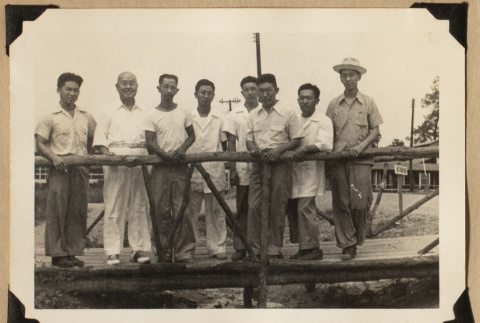 Men on a Rohwer bridge (ddr-densho-542-538)