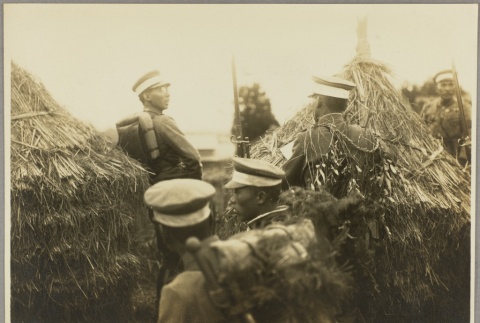 Soldiers amidst thatched structures (ddr-njpa-13-1550)