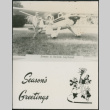 Season's greeting card with couple by small plane (ddr-densho-523-616)