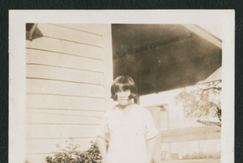 girl outside a house (ddr-densho-378-376)