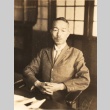 A man at his desk (ddr-njpa-4-2172)