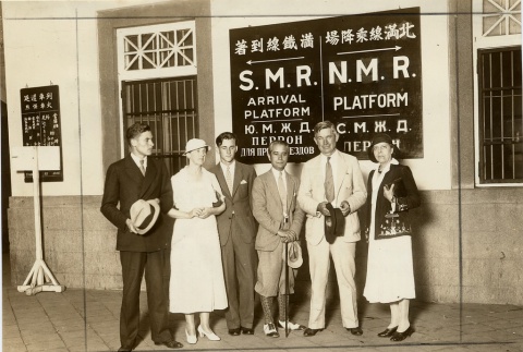A group posing in a train station (ddr-njpa-1-1552)