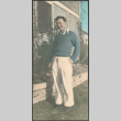 Man standing next to house (ddr-densho-523-14)