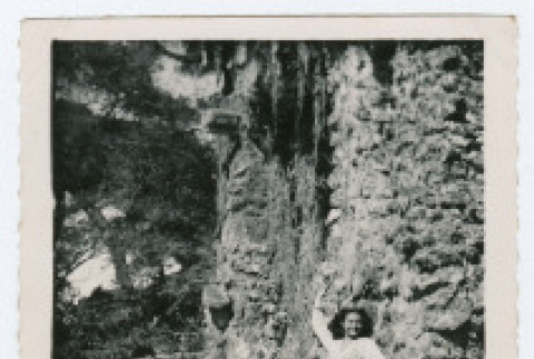 Woman posed on rocks near water (ddr-densho-368-193)