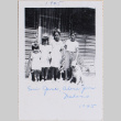 Four children with dog standing outside building (ddr-densho-464-114)